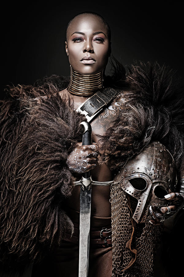 Beautiful black warrior princess holding a sword in studio shot #2 Photograph by Lorado