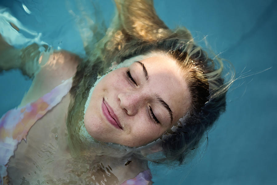 Beautiful portrait of teenage girl in pool water. #2 Photograph by Martinedoucet