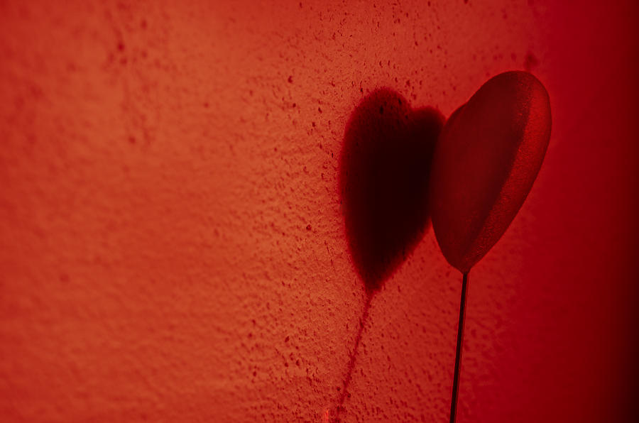 Beautiful red heart play game with a shadow on wall #2 Photograph by Osumposums