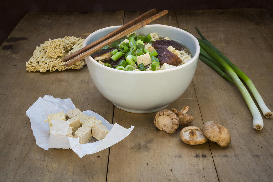 Bowl of miso ramen soup with organic tofu, shitake mushrooms and spring onions on dark wood #2 Photograph by Larissa Veronesi