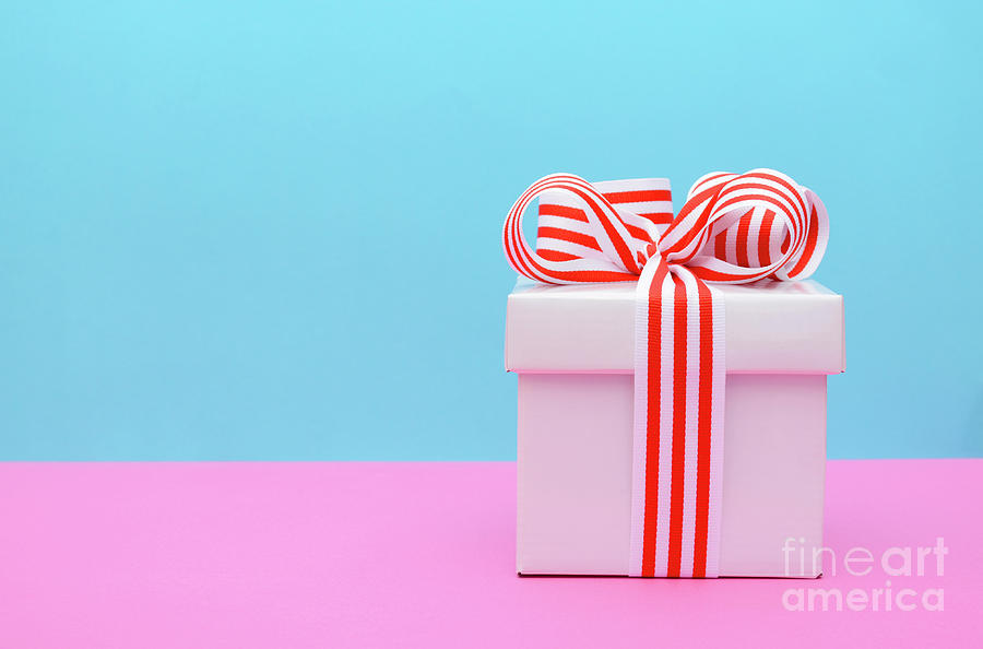 Bright color gift box on pink and blue background. Photograph by Milleflore  Images - Pixels