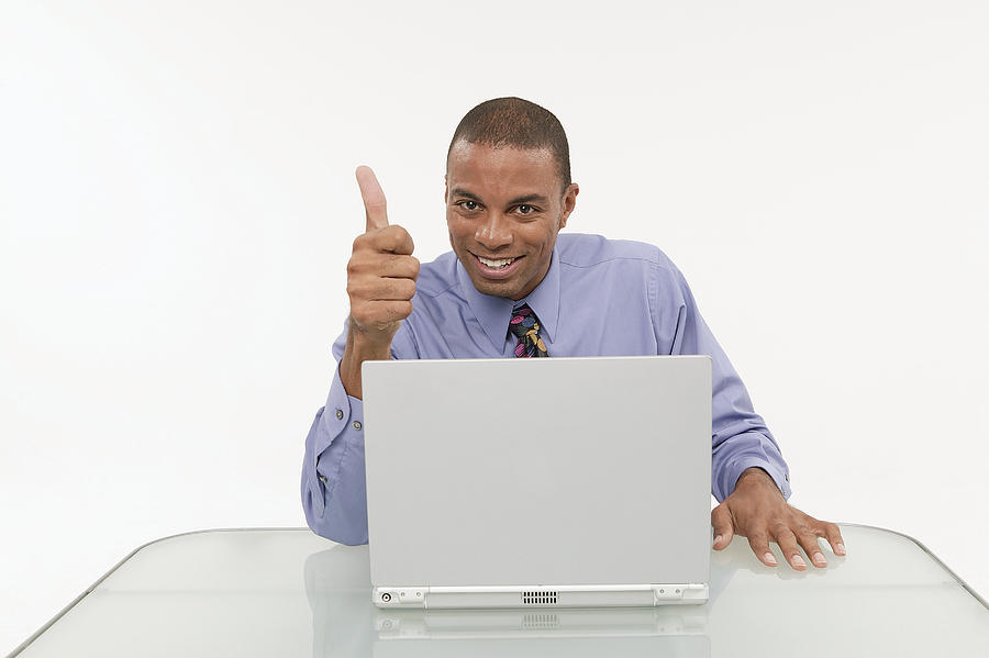 Businessman using a laptop #2 Photograph by Comstock Images