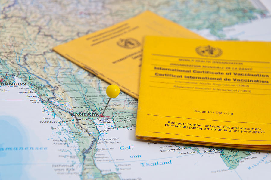 Close Up of Vaccination Certificate and world map. #2 Photograph by Nodramallama