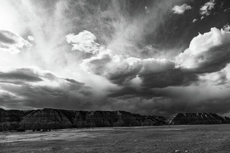 Clouds over Theodore Roosevelt National Park in North Dakota in black and white #2 Photograph by Eldon McGraw