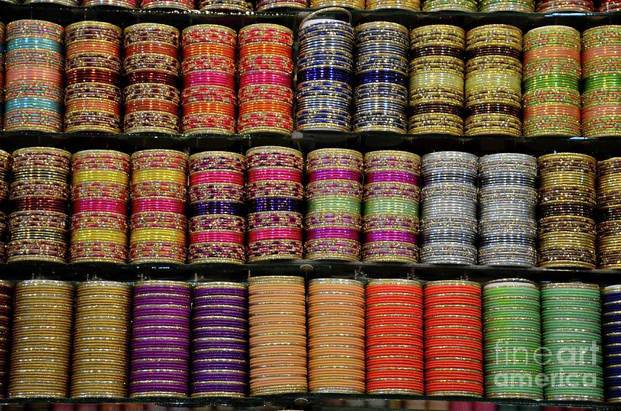 Colorful glass and metal bangles on display at shop shelf Clifton Karachi Pakistan #3 Photograph by Imran Ahmed