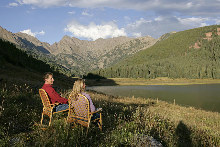 Couple by lake #2 Photograph by Comstock Images