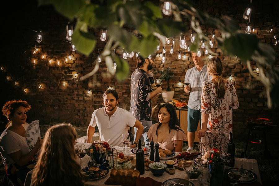Dinner party in back yard #2 Photograph by South_agency