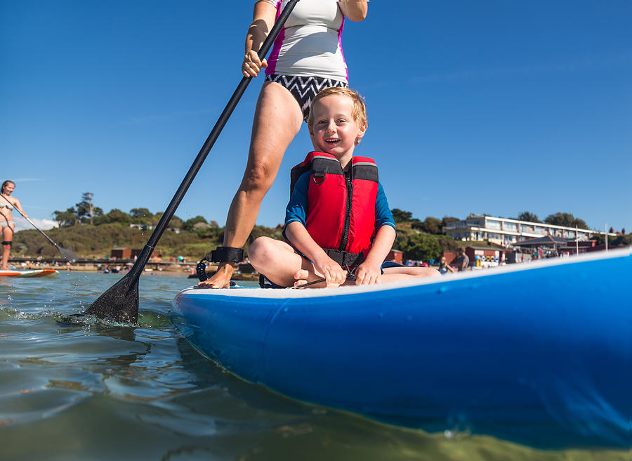 Family Stand Up Paddleboarding on the Isle of Wight. #2 Photograph by s0ulsurfing - Jason Swain