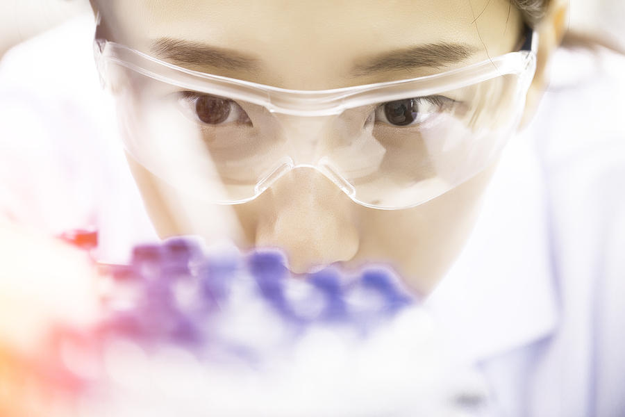 Female chemist at work in laboratory. #2 Photograph by Xubingruo