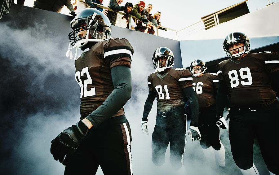 Football team walking out of stadium tunnel #2 Photograph by Thomas Barwick