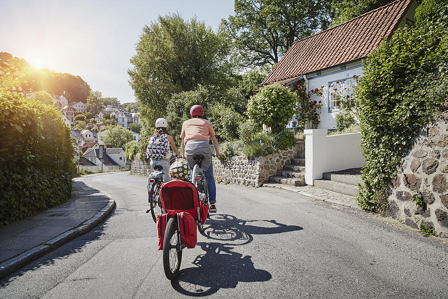 Germany, Hamburg, Blankenese, family riding e-bikes #2 Photograph by Westend61