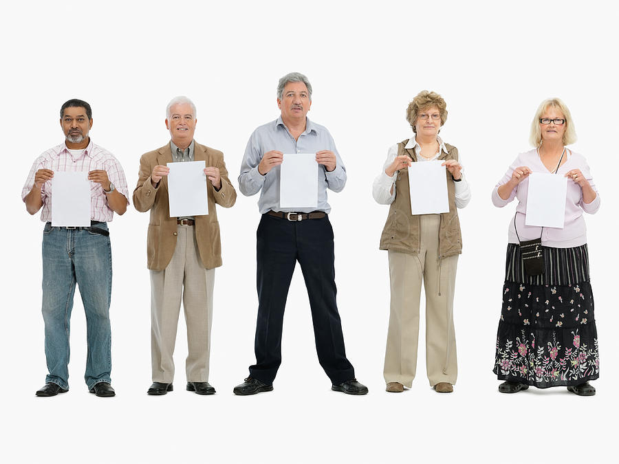 Group of people standing in a row holding papers #2 Photograph by Momentimages