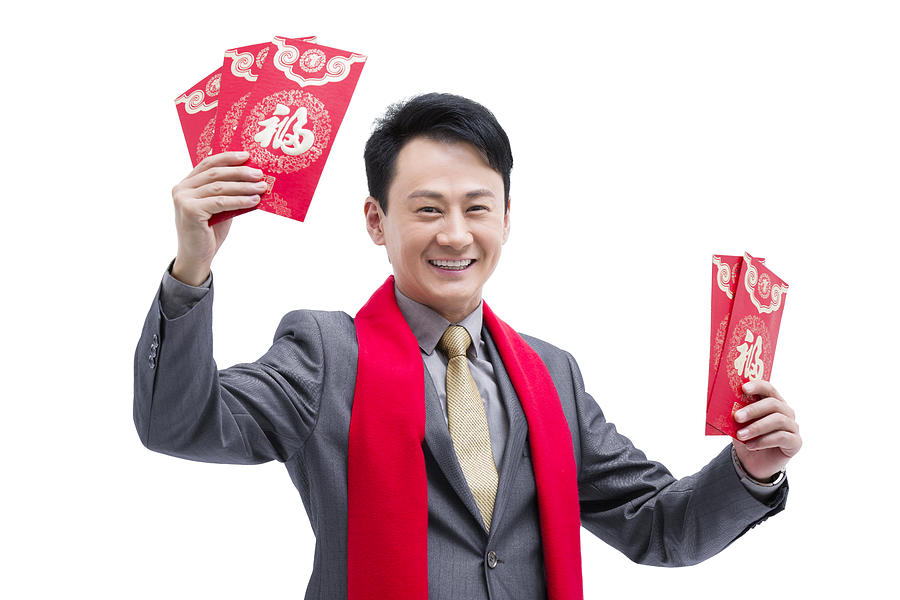 Happy business colleagues gifting traditional red envelopes #2 Photograph by BJI / Blue Jean Images