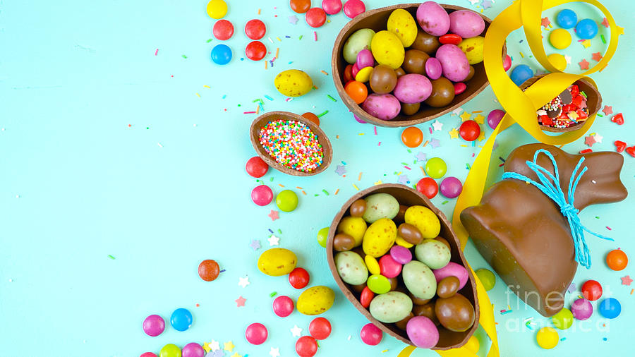 Happy Easter overhead with chocolate Easter eggs and decorations and copy space. #2 Photograph by Milleflore Images