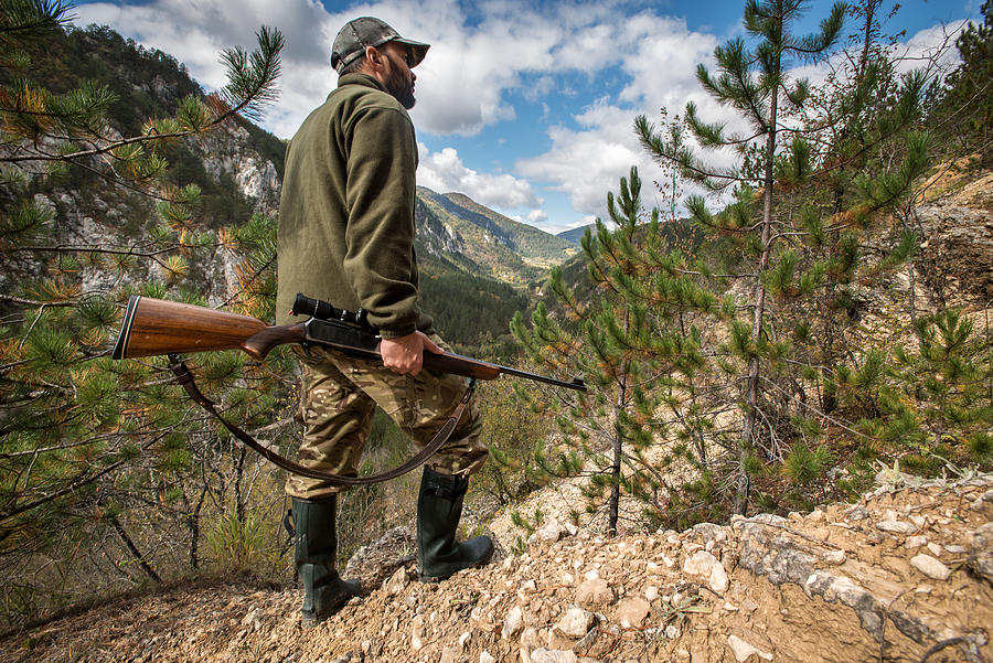 Hunter with rifle #2 Photograph by Predrag Vuckovic