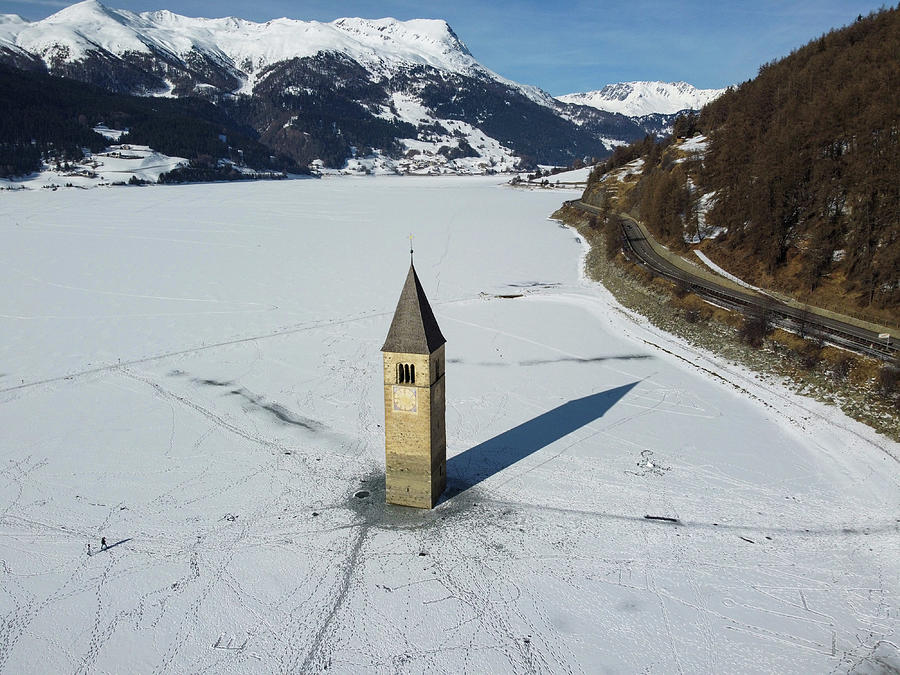 Il campanile sommerso del lago di Resia con la neve #2 Photograph by Pietro Ebner