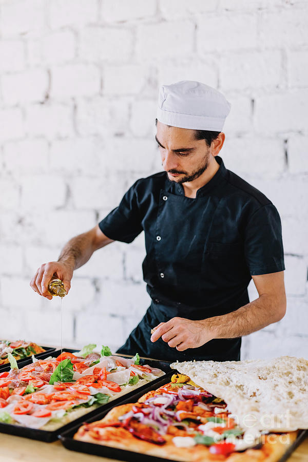 Italian Chef Pizzaiolo Making Sicilian Pizza In Restaurant Kitchen ...