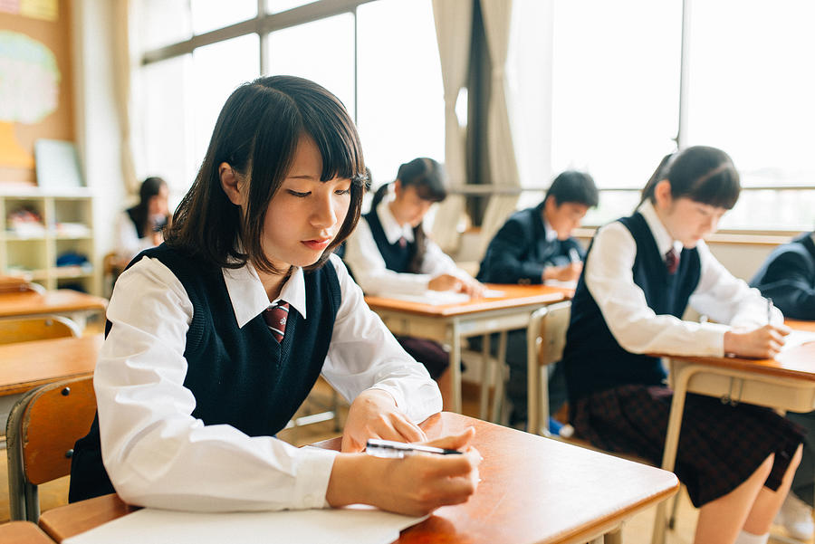 Japanese High School Students doing exams #2 Photograph by Ferrantraite