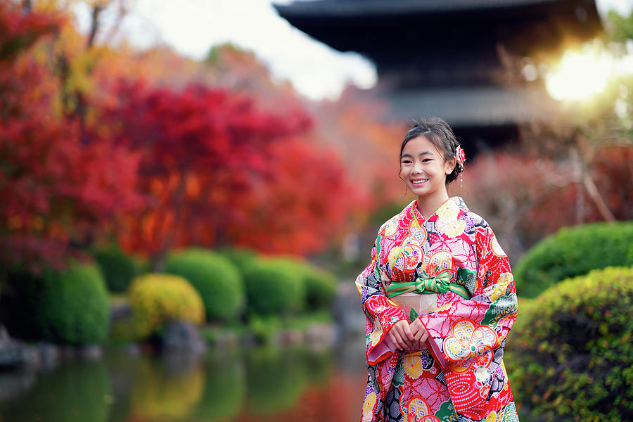 Japanese tourist girl in red Kimono traditional dress walking in #2 Photograph by Anek Suwannaphoom