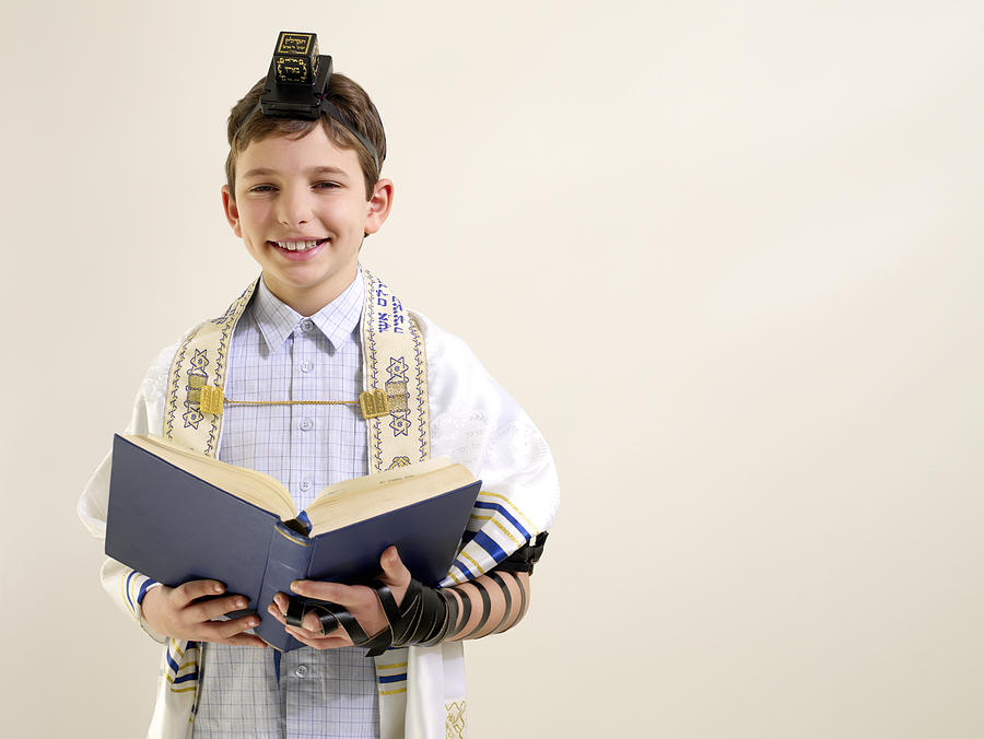 Jewish boy reading from siddur #2 Photograph by Image Source