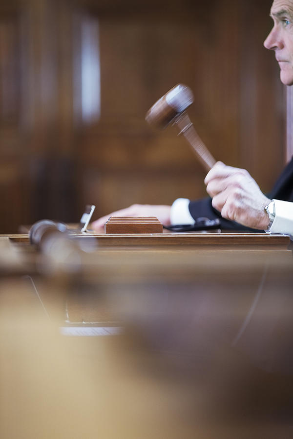 Judge banging gavel in court #2 Photograph by Caia Image