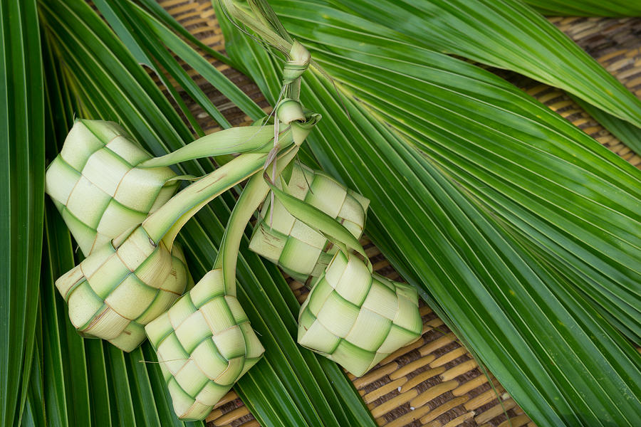 Ketupat, Kupat or Tipat is a type of dumpling made from rice packed inside a diamond-shaped container of woven palm leaf pouch. It is commonly found in Indonesia, Malaysia, Brunei and Singapore. #2 Photograph by Shaifulzamri