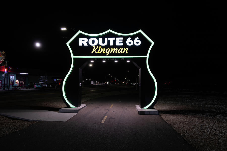 Large Route 66 sign in Kingman Arizona at night #2 Photograph by Eldon McGraw