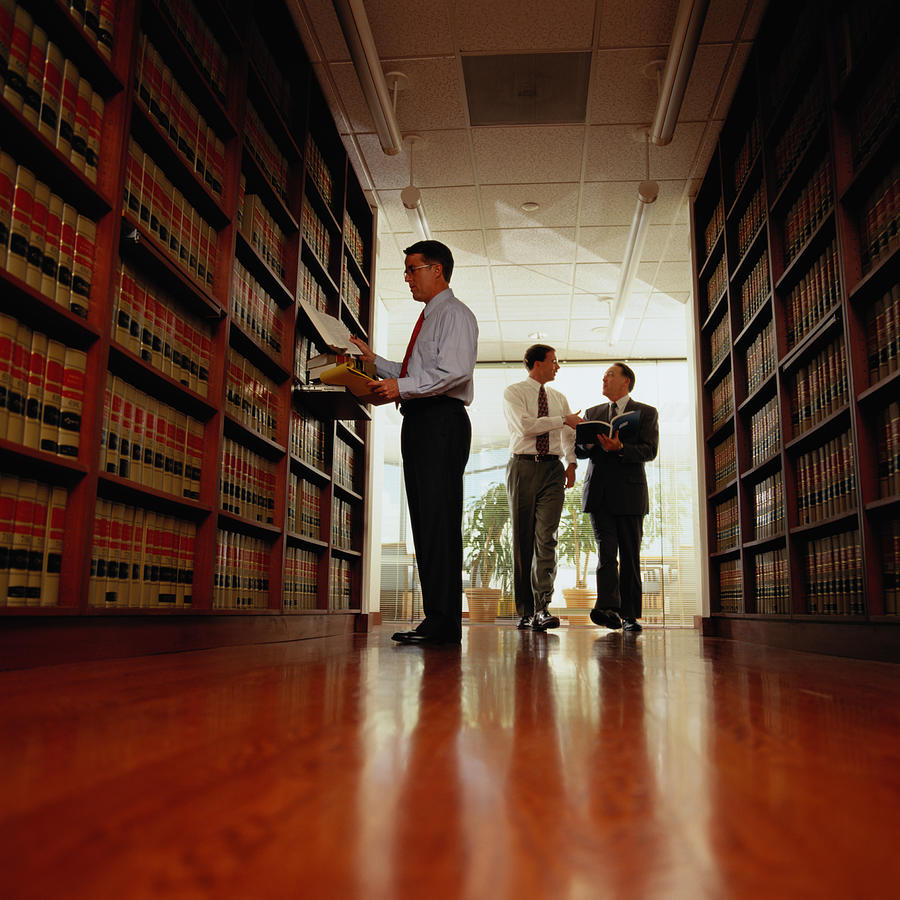 Lawyer Researching Information in a Law Library #2 Photograph by Keith Brofsky