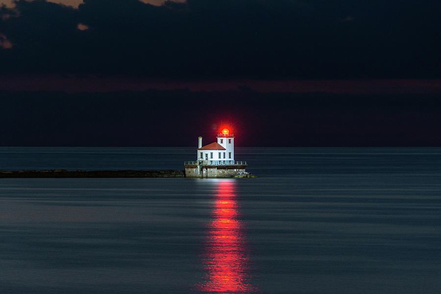 Lighthouse lit up at night Photograph by Wayne Kirby | Fine Art America