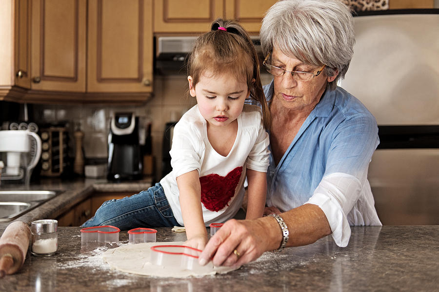 Little girl making cookies with grandma #2 Photograph by Lise Gagne