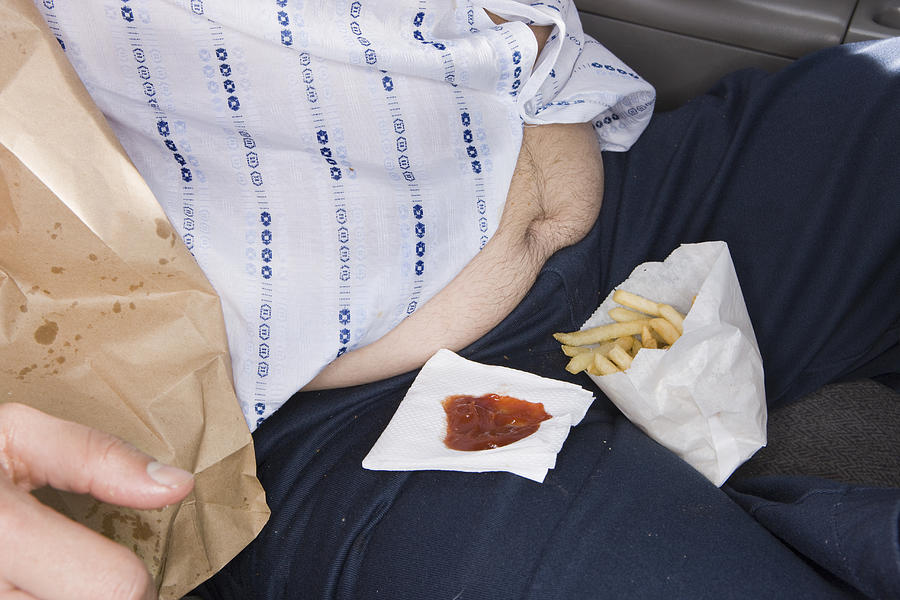 Man eating fast food in his car #2 Photograph by Sian Kennedy