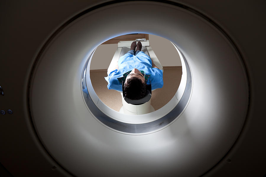 Man having a medical examination via MRI scan #2 Photograph by Selimaksan