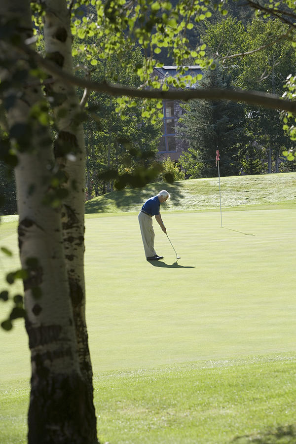 Man playing golf #2 Photograph by Comstock Images