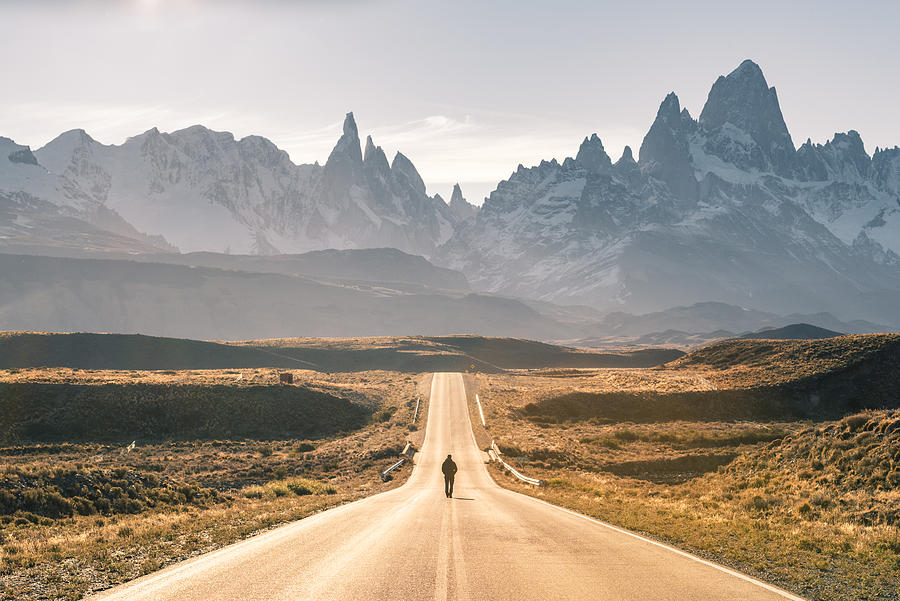 Man walking on the road to Fitz Roy range, Patagonia Argentina #2 Photograph by © Marco Bottigelli