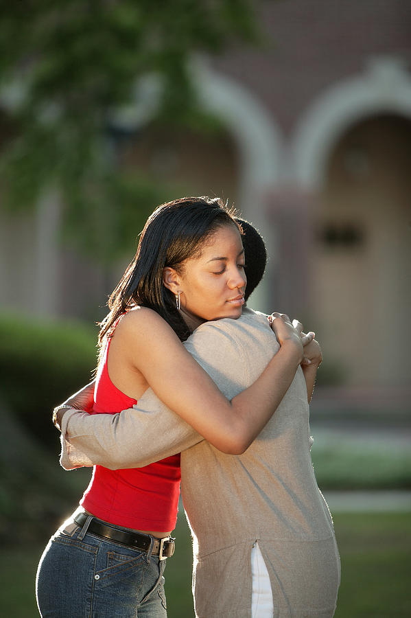 Mother and daughter embracing #2 Photograph by Comstock Images