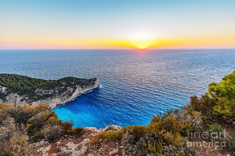 Navagio shipwreck beach in Zakynthos Greece at sunset #2 Photograph by Michal Bednarek