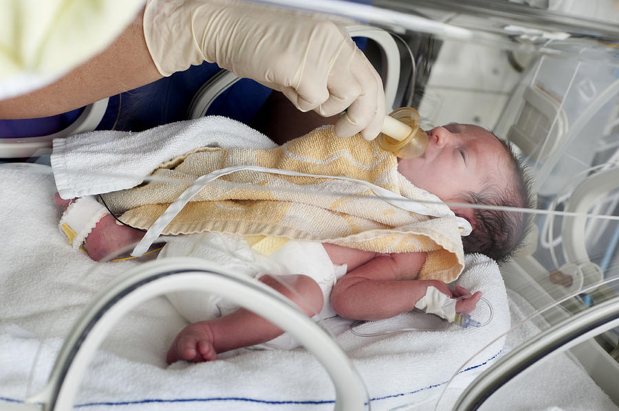 Newborn baby in incubator #2 Photograph by Metinkiyak