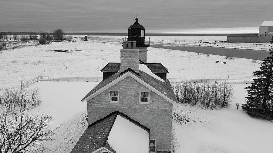Ontonagon Michigan Lighthouse along Lake Superior in winter in black and white #2 Photograph by Eldon McGraw