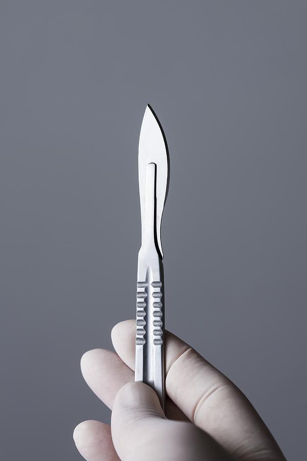 Person holding scalpel #2 Photograph by Cristina Pedrazzini/science Photo Library