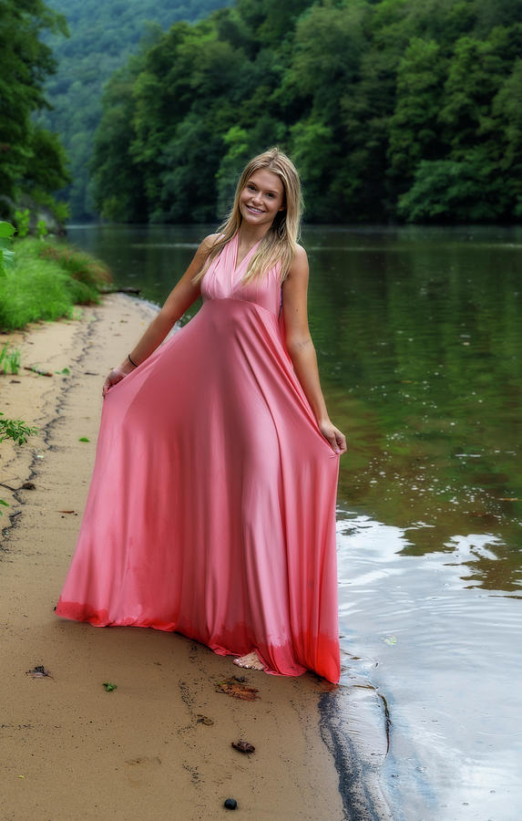 Pretty woman standing on shore in pink dress #2 Photograph by Dan Friend
