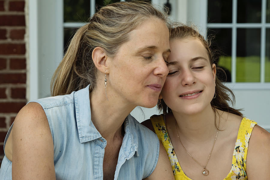 Real family portrait of mother and teenage daughter on home porch in summer. #2 Photograph by Martinedoucet