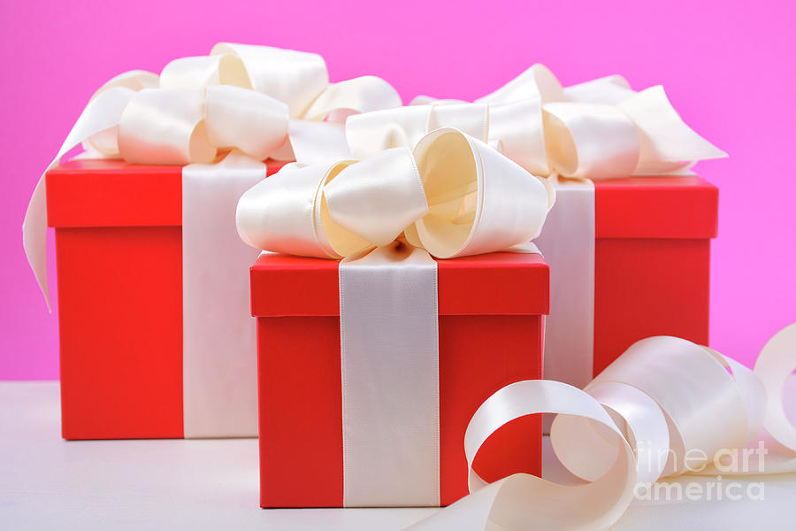 Red and white gifts on pink background.  #2 Photograph by Milleflore Images