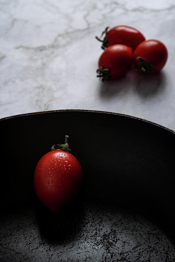 Red fresh healthy tomatoes isolated on a black pan #2 Photograph by Michalakis Ppalis