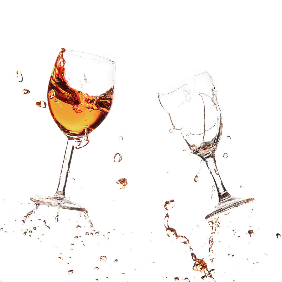 Red wine in glasses with splashes on a white background isolated Photograph by Michalakis Ppalis
