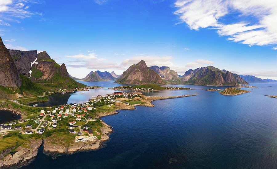 Reine fishing village surrounded by high mountains and fjords on ...