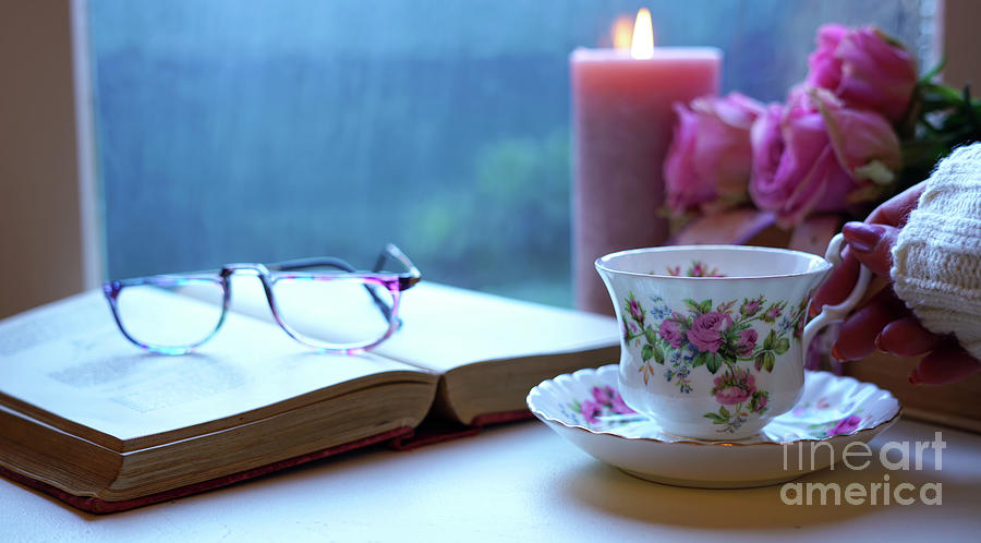 Relaxing By The Window On A Cold Rainy Day With Books And Cup Of Tea Photograph By Milleflore Images