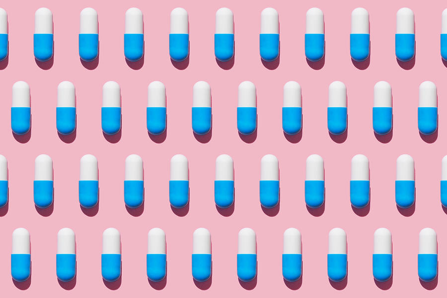 Repeated pills on pink background #2 Photograph by Yulia Reznikov