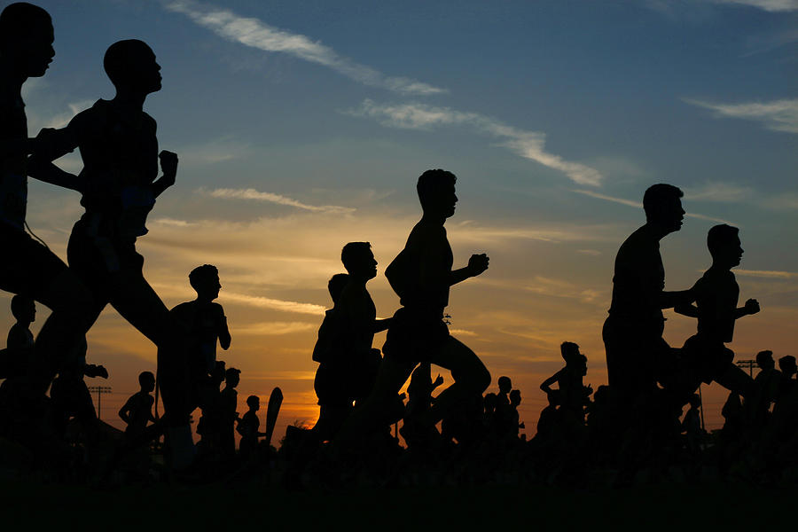 Runners compete in a 5k at sunset in Corona, California. #2 Photograph by K.C. Alfred