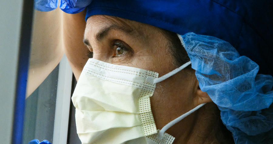 Sad, sick, overworked, female health care worker #2 Photograph by Juanmonino