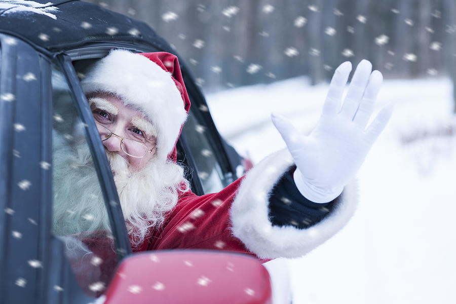 Santa Claus at car #2 Photograph by Vesnaandjic
